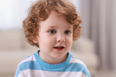 Photo of Portrait of little boy indoors. Cute child