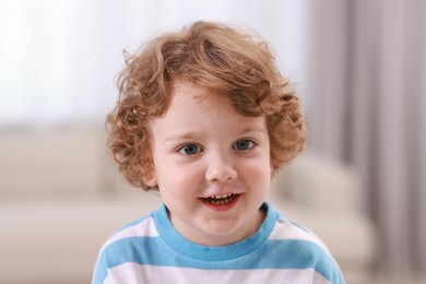 Portrait of little boy indoors. Cute child