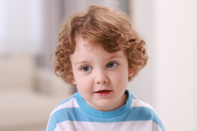 Photo of Portrait of little boy indoors. Cute child