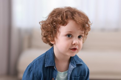 Portrait of little boy indoors. Cute child