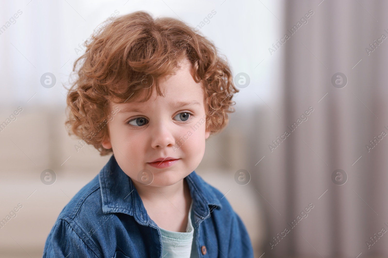 Photo of Portrait of little boy indoors, space for text. Cute child