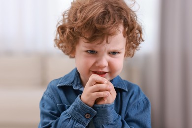 Photo of Portrait of emotional little boy indoors. Cute child