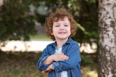 Portrait of little boy outdoors. Cute child