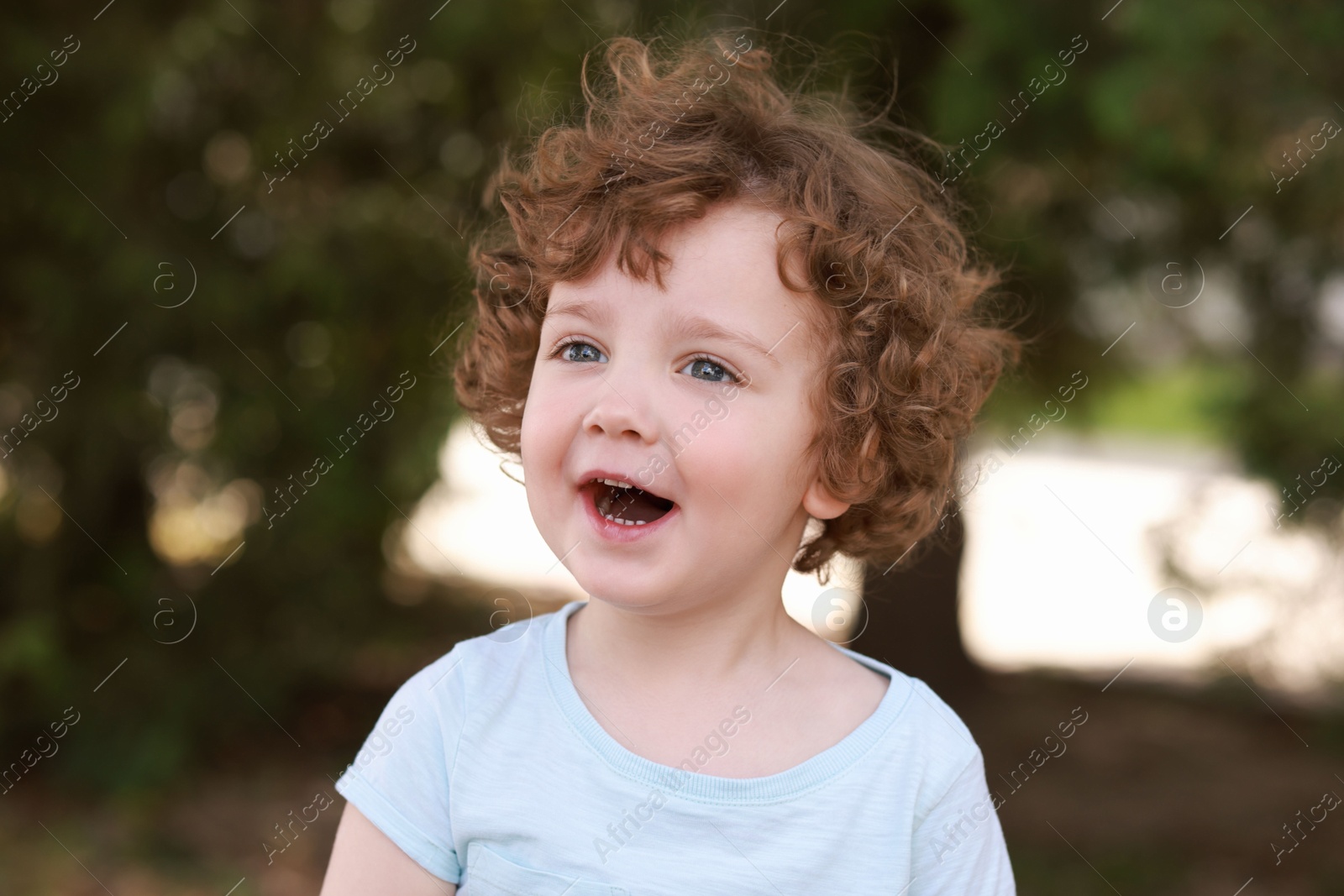 Photo of Portrait of little boy outdoors. Cute child