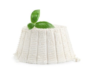 Fresh ricotta (cream cheese) and basil isolated on white