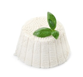 Photo of Fresh ricotta (cream cheese) and basil isolated on white