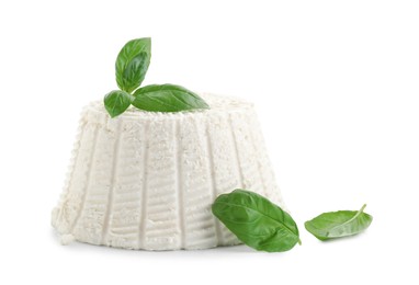 Fresh ricotta (cream cheese) and basil isolated on white