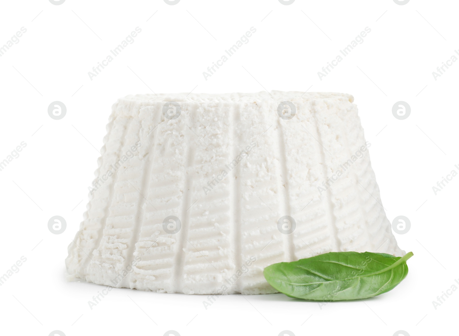 Photo of Fresh ricotta (cream cheese) and basil isolated on white