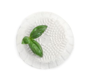 Photo of Fresh ricotta (cream cheese) and basil isolated on white, top view