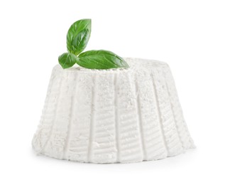 Fresh ricotta (cream cheese) and basil isolated on white