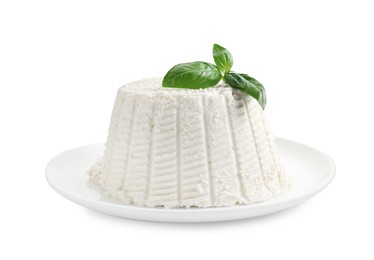 Photo of Fresh ricotta (cream cheese) with basil isolated on white