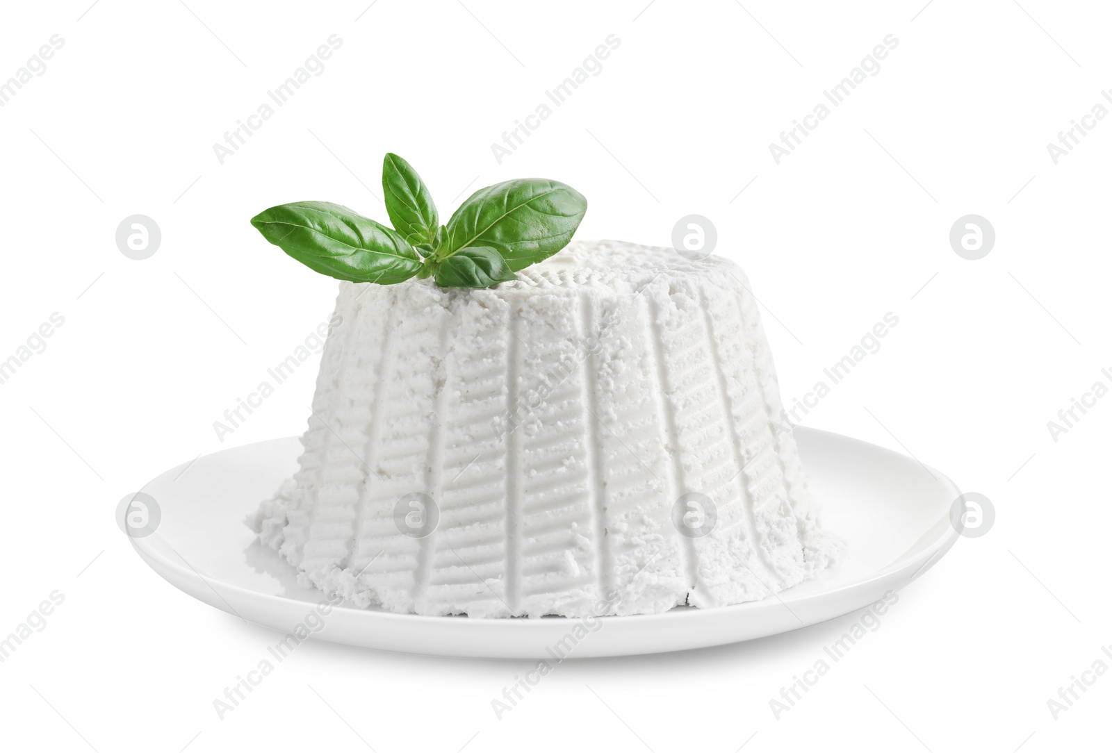 Photo of Fresh ricotta (cream cheese) with basil isolated on white