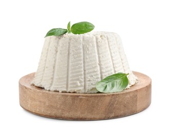 Photo of Fresh ricotta (cream cheese) with basil isolated on white