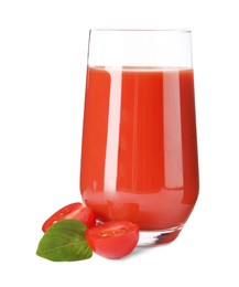 Tasty tomato juice in glass, basil and fresh vegetable isolated on white