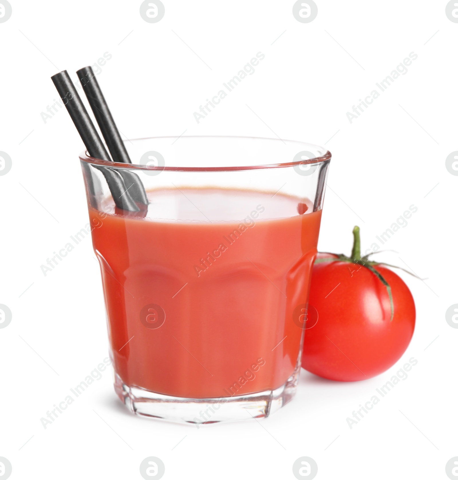 Photo of Tasty tomato juice in glass and fresh vegetable isolated on white