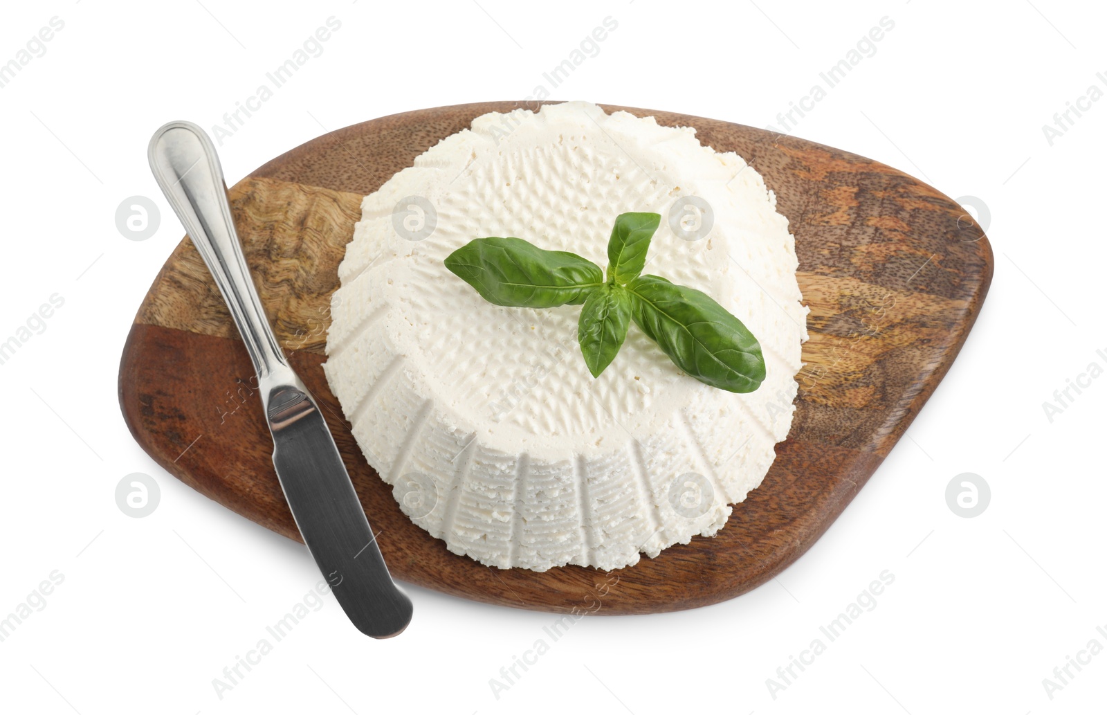 Photo of Tasty ricotta (cream cheese), basil and knife isolated on white, top view