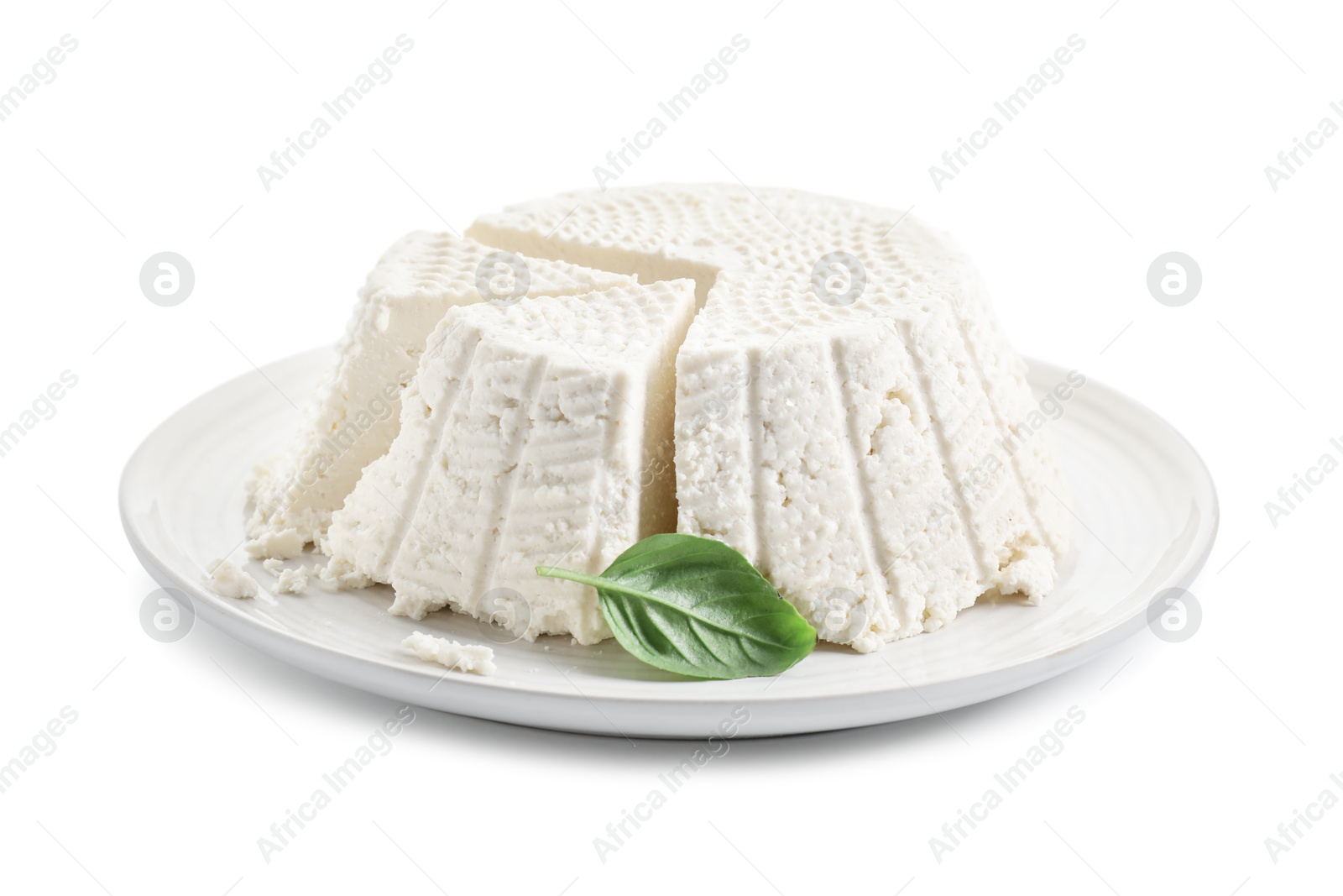 Photo of Tasty ricotta (cream cheese) and basil isolated on white