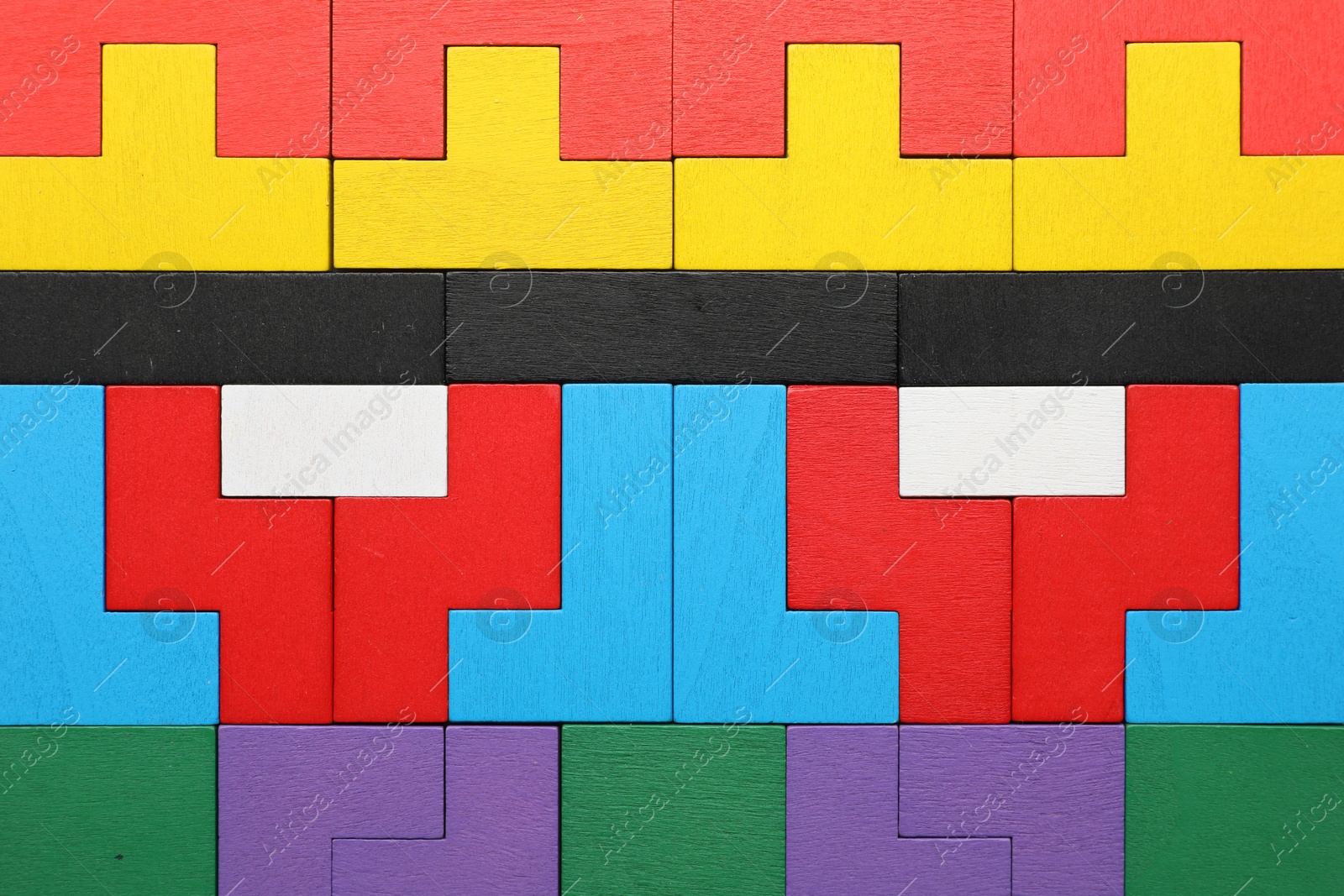 Photo of Colorful wooden puzzle pieces as background, top view