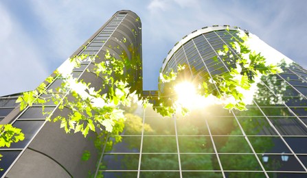 Environment. Modern building and trees on sunny day, double exposure