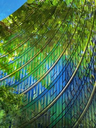 Image of Environment. Modern building and trees, double exposure