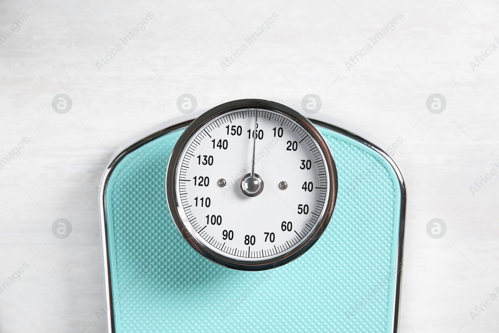 Photo of One bathroom scale on white wooden background, top view