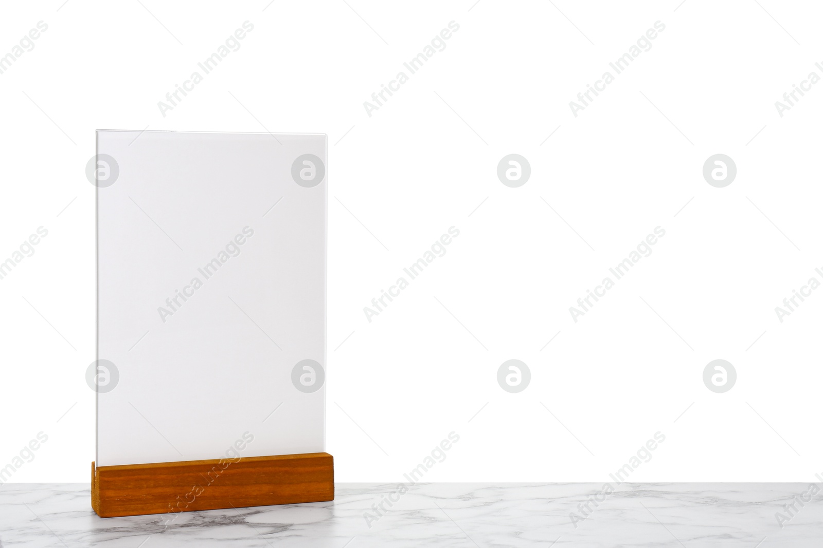 Photo of Menu holder on light marble table against white background. Space for text