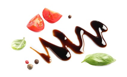 Delicious balsamic vinegar, cut tomato, basil and peppercorns isolated on white