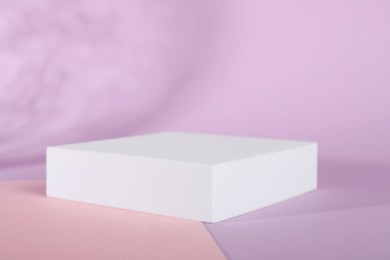 Photo of Presentation of product. Podium on color background, space for text