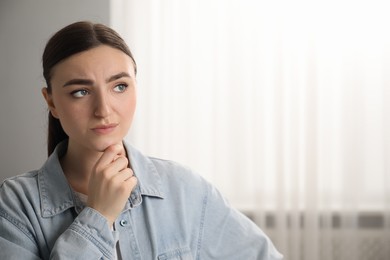 Photo of Embarrassed woman in office, space for text