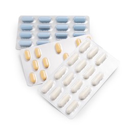 Different antibiotic pills isolated white, top view