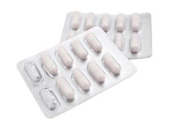 Photo of Antibiotic pills in blisters isolated on white