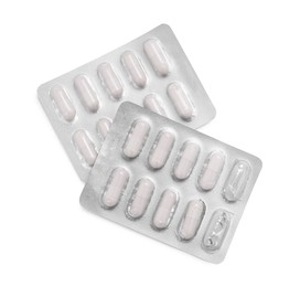 Antibiotic pills in blisters isolated on white, top view