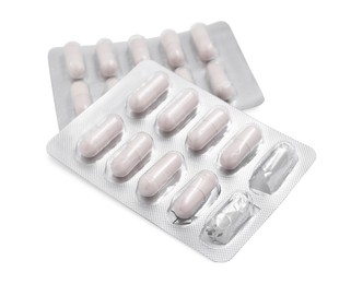 Photo of Antibiotic pills in blisters isolated on white