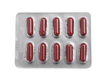 Photo of Antibiotic pills in blister isolated on white, top view