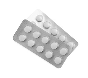 Photo of Antibiotic pills in blisters isolated on white, top view