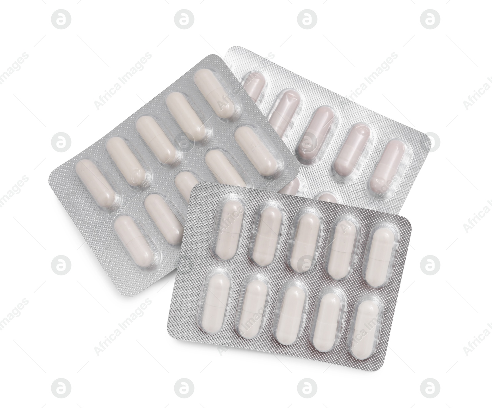 Photo of Antibiotic pills in blisters isolated on white, top view