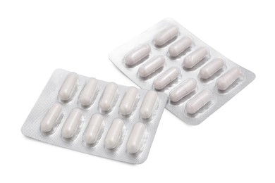 Photo of Antibiotic pills in blisters isolated on white