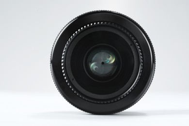 Photo of Camera lens on white background. Photographer's equipment