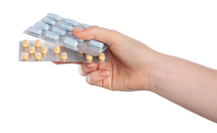 Woman with antibiotic pills on white background, closeup