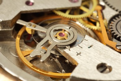 Mechanism of vintage wrist watch as background, closeup