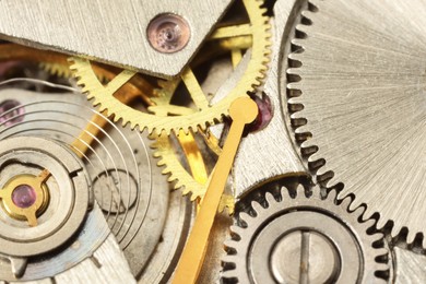 Mechanism of vintage wrist watch as background, closeup