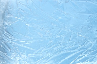 Photo of Beautiful clear ice as background, closeup view