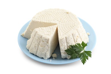 Tasty ricotta (cream cheese) and parsley isolated on white