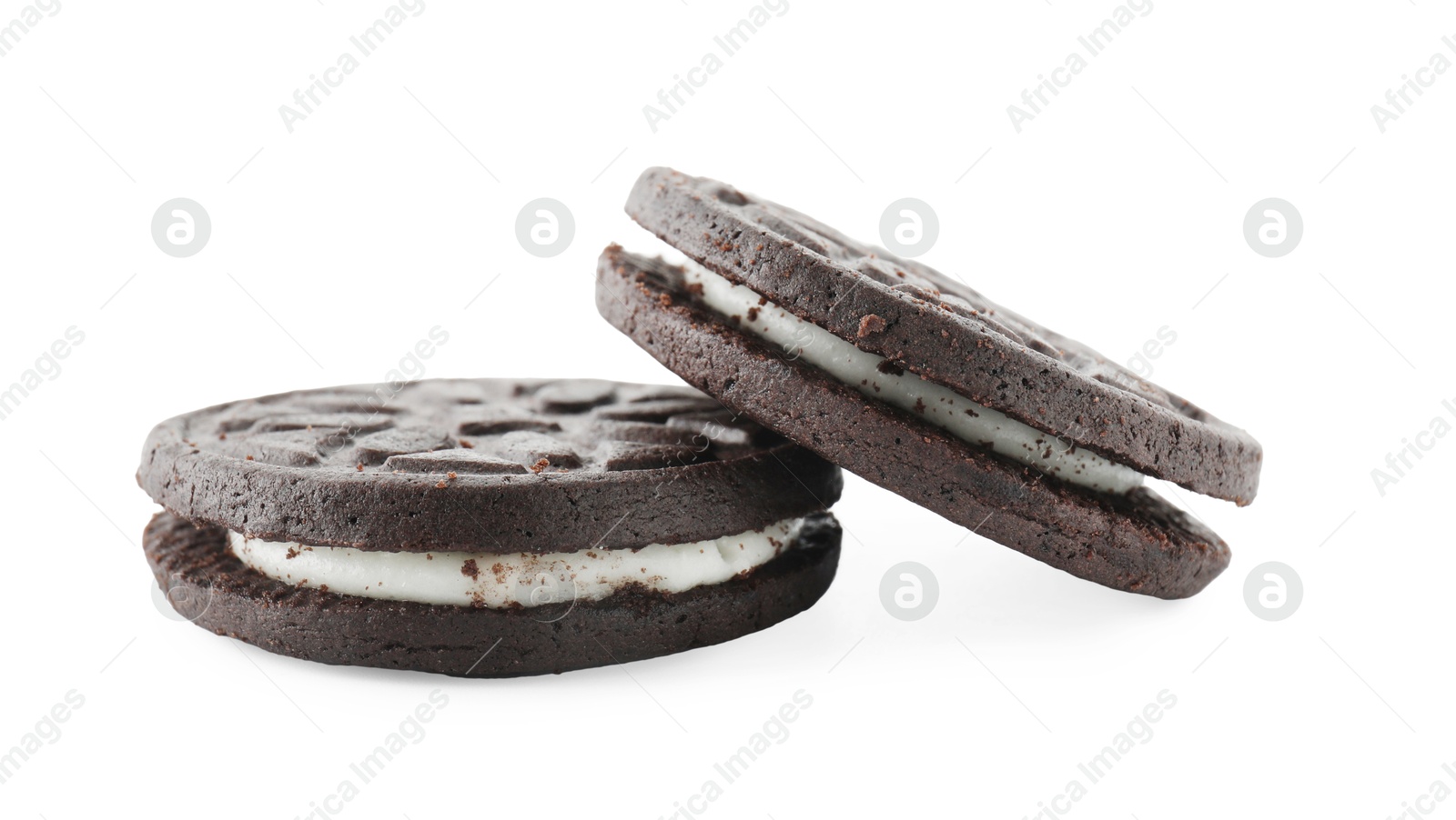 Photo of Two tasty sandwich cookies isolated on white