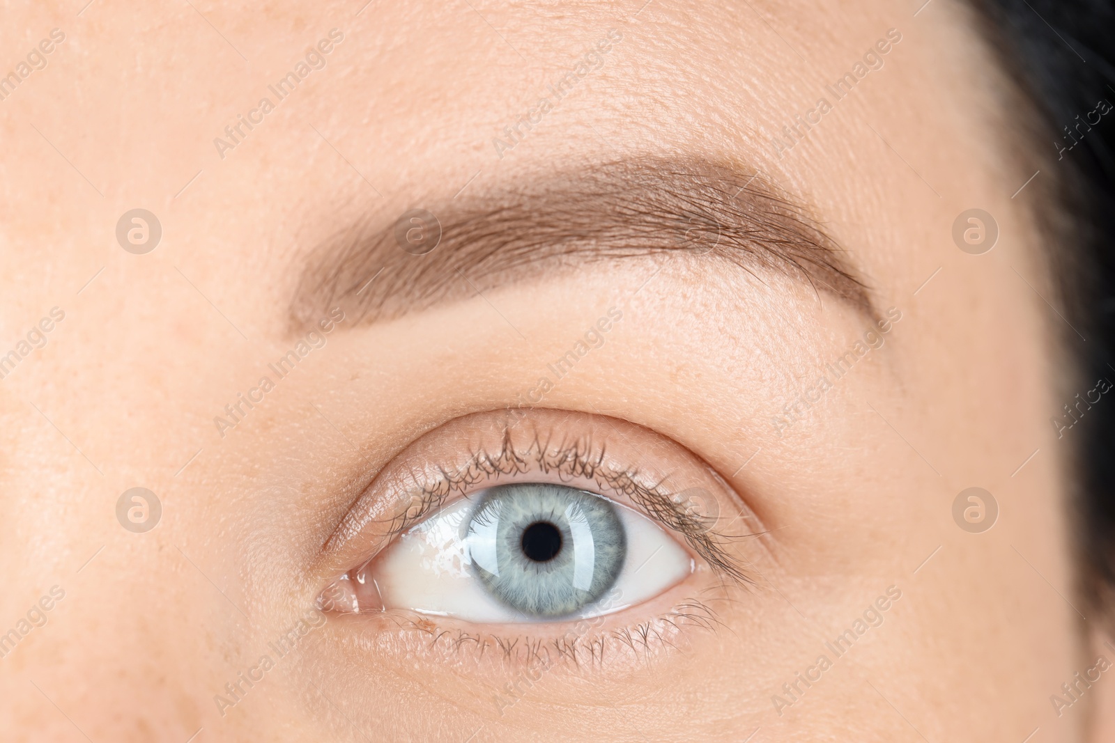 Photo of Woman with beautiful blue eyes, macro photo