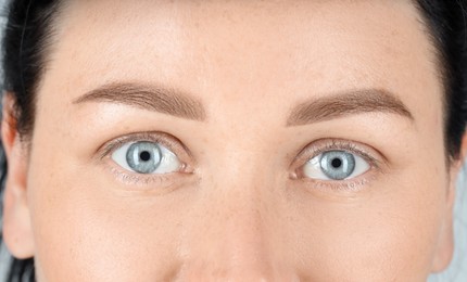 Photo of Woman with beautiful blue eyes, closeup view