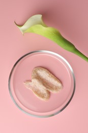 Petri dish with cosmetic product and calla lily flower on pink background, flat lay