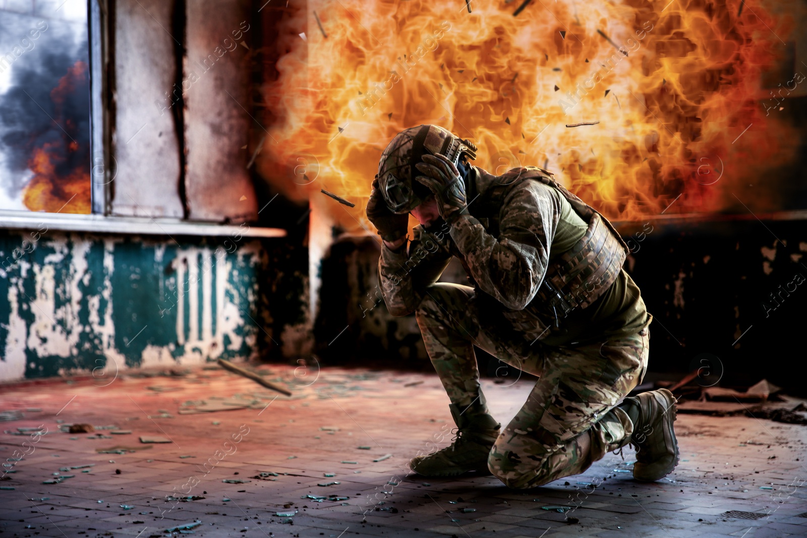 Image of Soldier covering himself from explosion during military operation