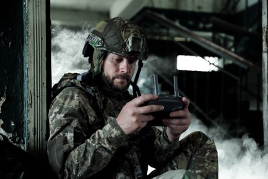 Image of Soldier with drone controller inside building during military operation