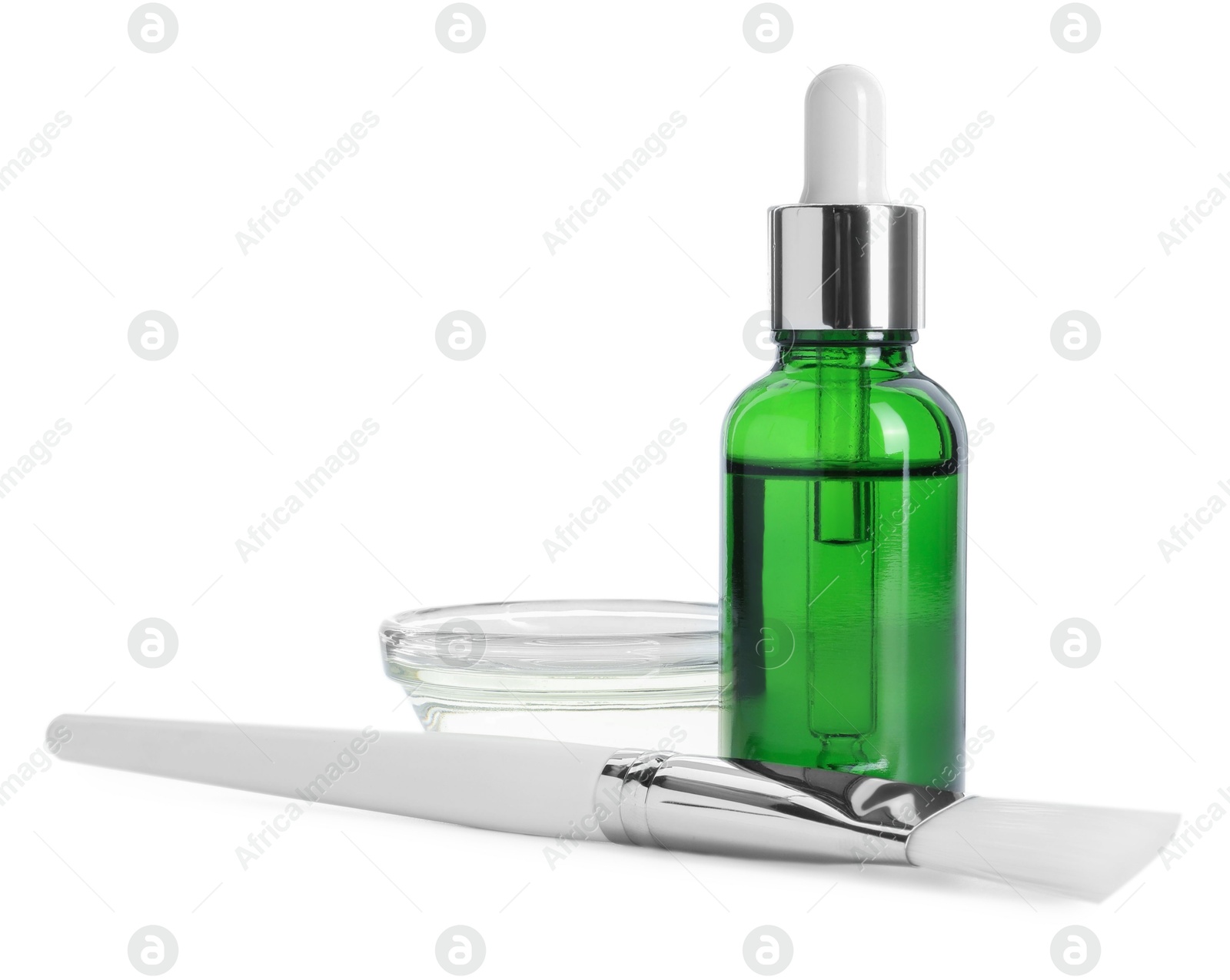 Photo of Bottle of chemical peel, bowl with liquid and brush isolated on white. Peeling procedure